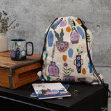 Sac à dos compact - Still Life, objet décoratifs, vases, plantes, visage, mauve, bleu, orangé sur fond beige clair, lifestyle